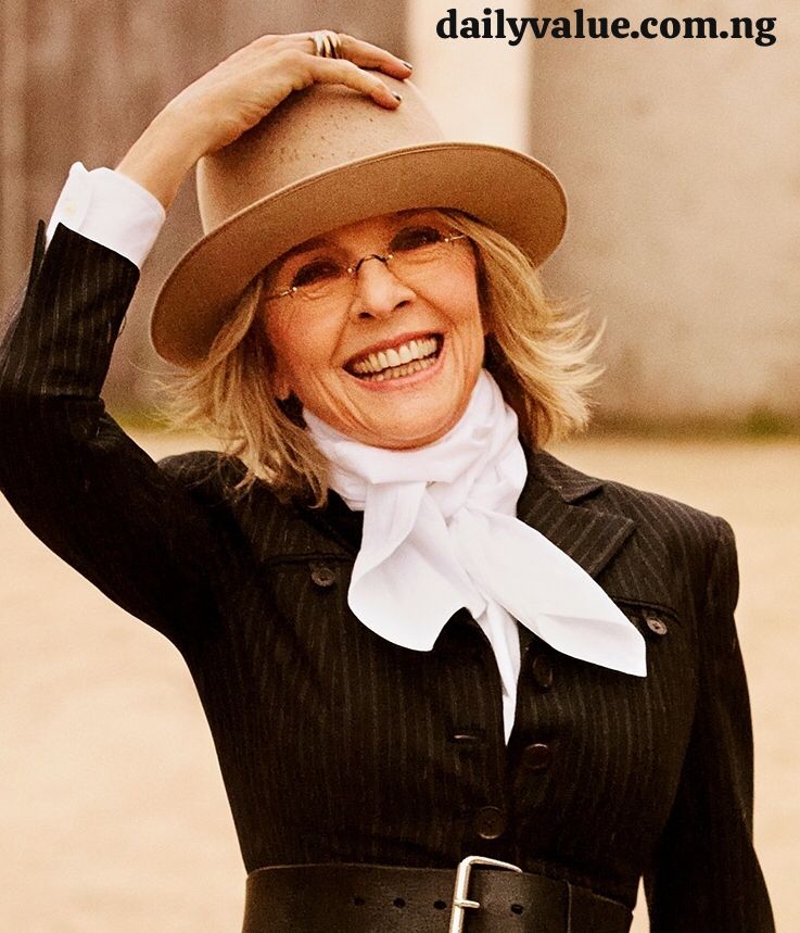 Diane Keaton in a classic portrait pose wearing her signature hat and suit